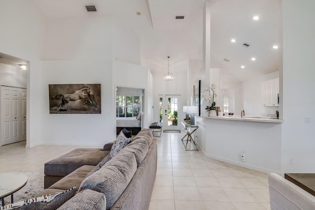 2156 Wightman Dr, Wellington, FL 33414 - living room featuring recessed lighting, light tile patterned floors, visible vents, and a high ceiling