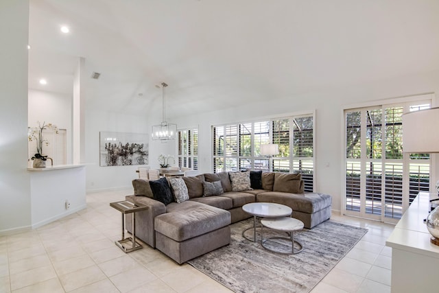 tiled living room featuring vaulted ceiling and an inviting chandelier