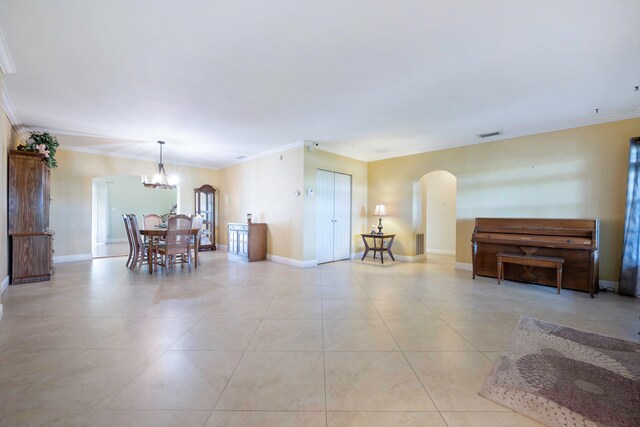 interior space with ornamental molding, light tile patterned floors, and an inviting chandelier