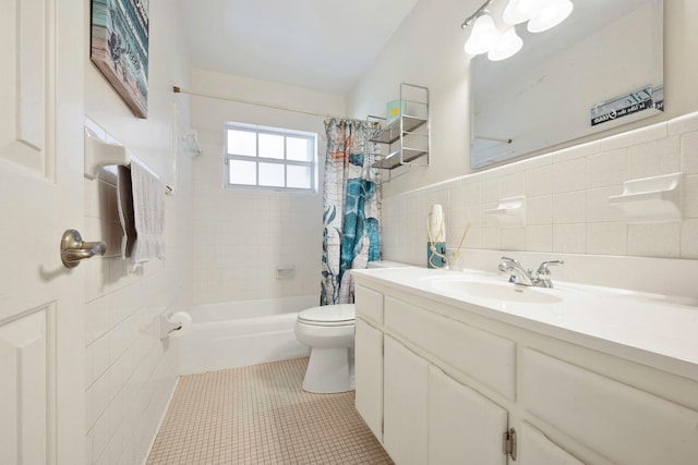 full bathroom featuring vanity, tile patterned flooring, toilet, tile walls, and shower / tub combo