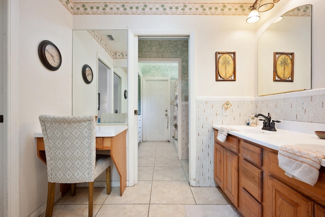 bathroom with tile patterned floors and vanity