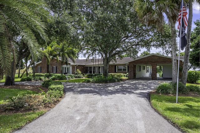 ranch-style house featuring a carport