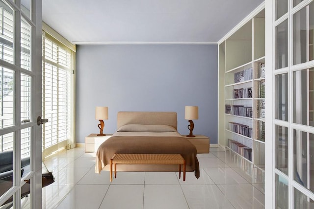 bedroom featuring french doors and light tile patterned flooring