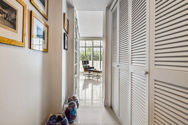 corridor with light tile patterned floors