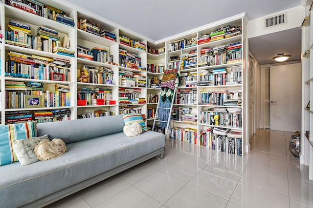 living area with light tile patterned floors