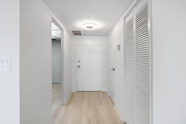 hallway featuring light wood-type flooring