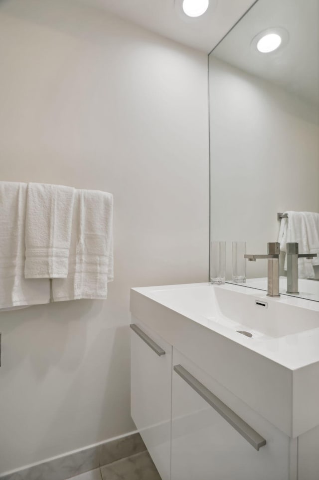 bathroom with oversized vanity and tile floors