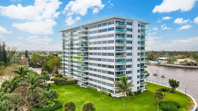 view of building exterior with a water view