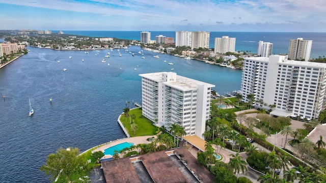 birds eye view of property with a water view