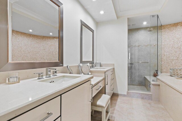 bathroom featuring vanity, tile floors, and a tile shower