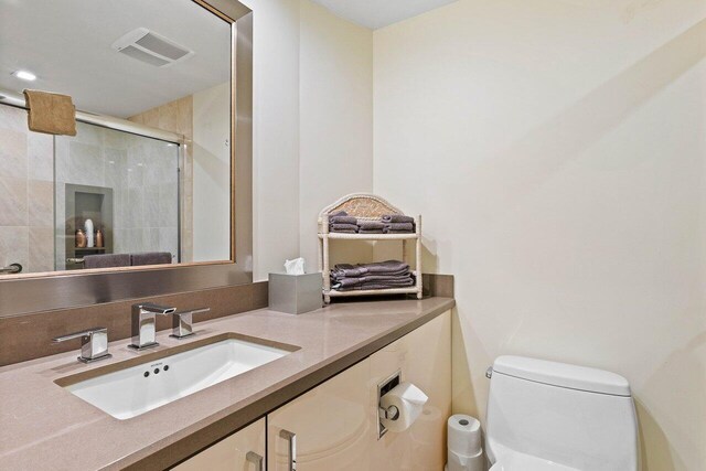 bathroom featuring toilet and vanity