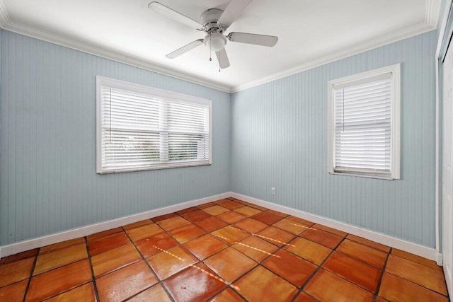 empty room with ceiling fan and ornamental molding