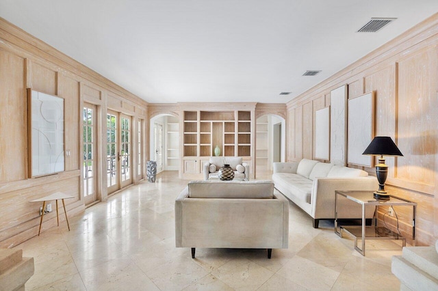 tiled living room featuring french doors