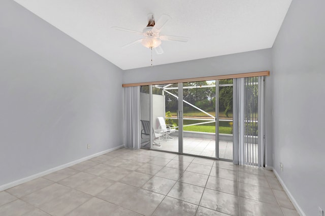 tiled spare room with ceiling fan