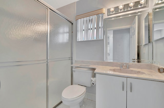 bathroom with tile floors, oversized vanity, a shower with shower door, and toilet