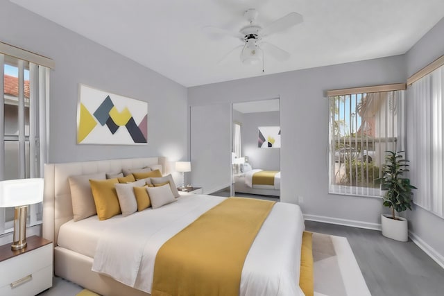 bedroom with ceiling fan and hardwood / wood-style flooring