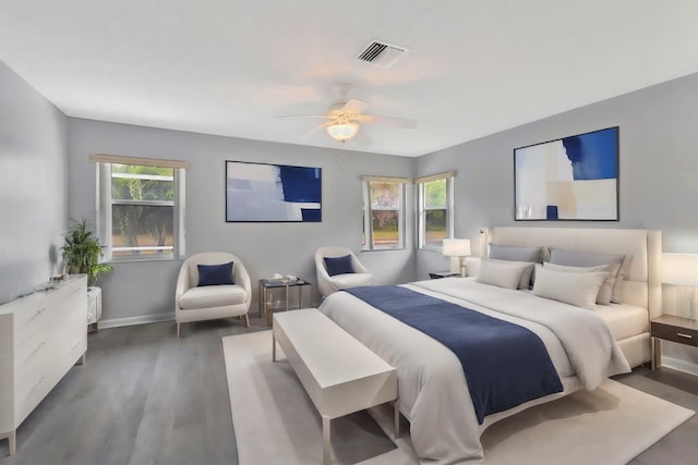 bedroom featuring ceiling fan and dark hardwood / wood-style floors