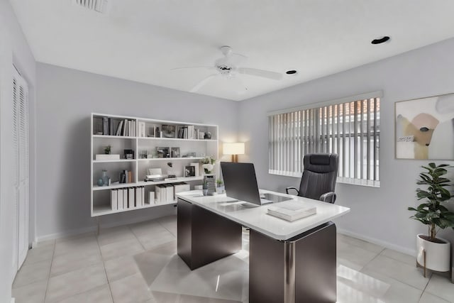 office with light tile flooring and ceiling fan