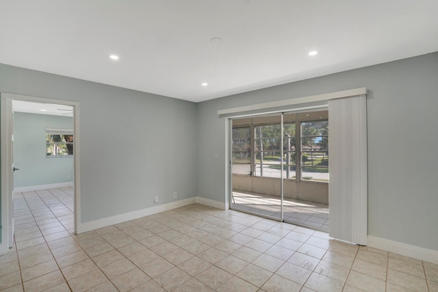 spare room featuring light tile patterned floors