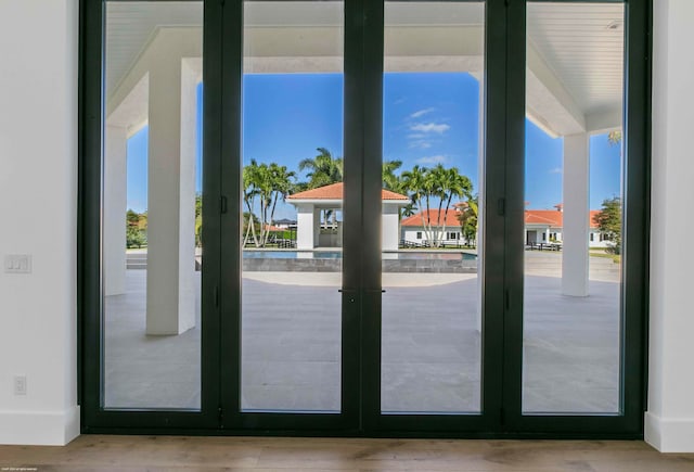 doorway to outside with french doors and light hardwood / wood-style flooring