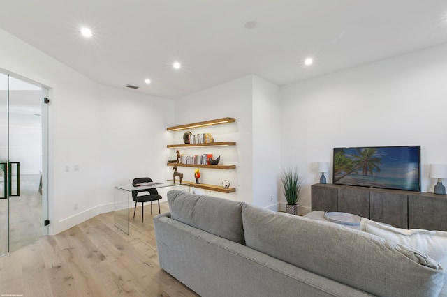 living room with light hardwood / wood-style flooring