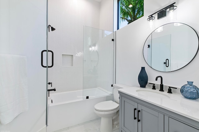 full bathroom featuring bath / shower combo with glass door, toilet, and vanity