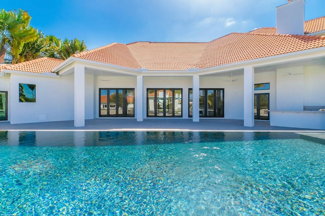 view of pool featuring a patio area and ceiling fan