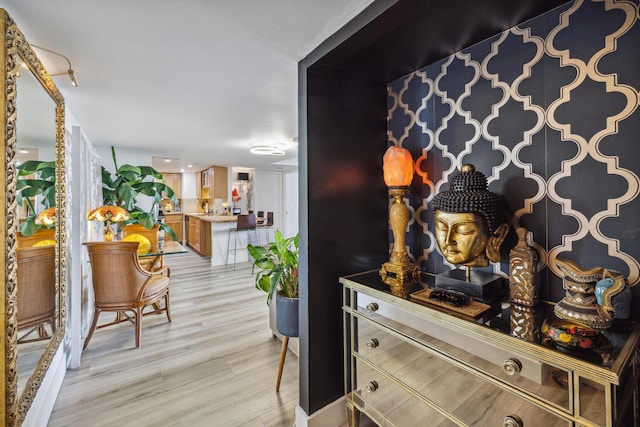 hallway with light hardwood / wood-style flooring