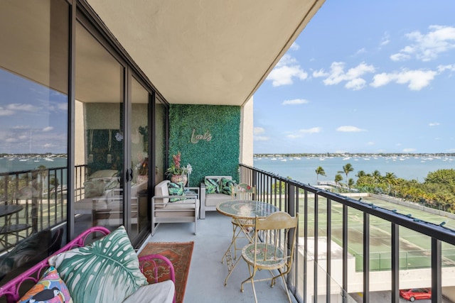 balcony featuring a water view