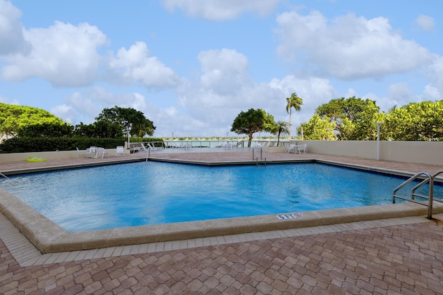 view of swimming pool with a patio