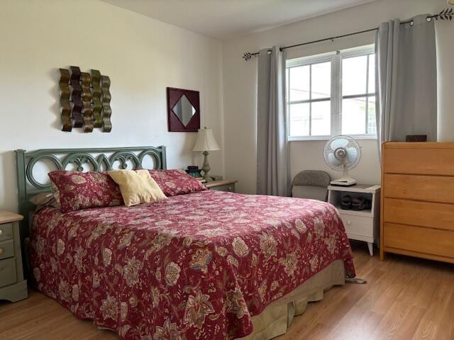 bedroom with light wood-type flooring