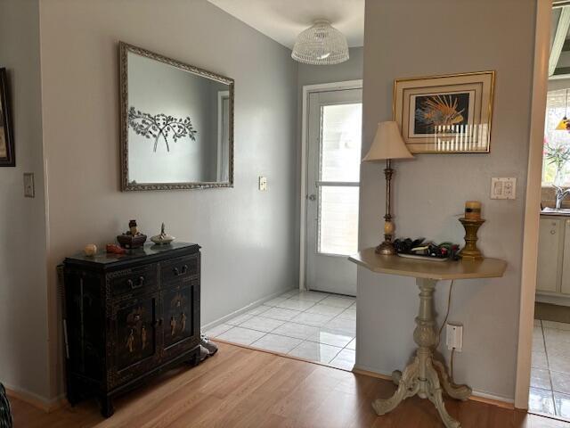 doorway to outside with light hardwood / wood-style flooring