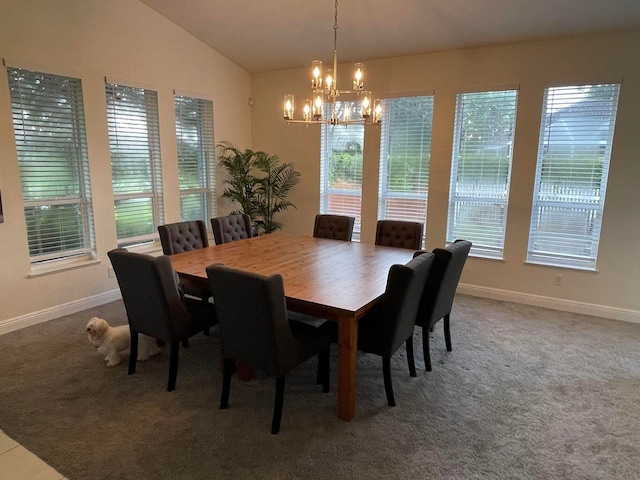 carpeted dining room featuring a notable chandelier and vaulted ceiling