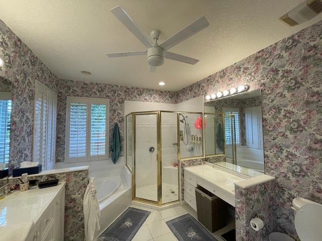 bathroom with ceiling fan, plus walk in shower, tile flooring, a textured ceiling, and vanity