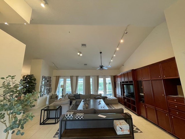 tiled living room with track lighting, high vaulted ceiling, and ceiling fan