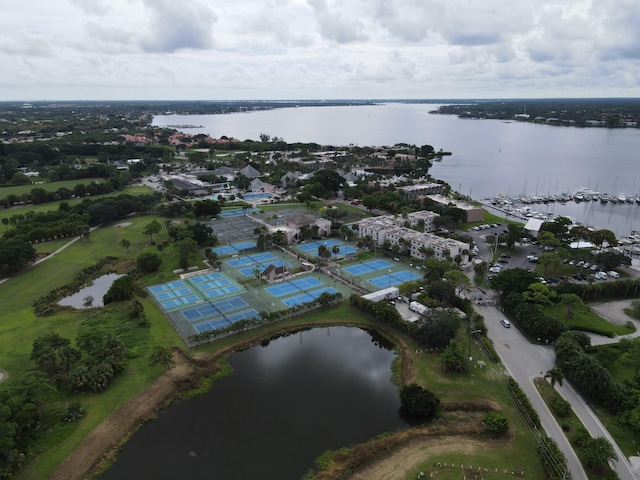 birds eye view of property with a water view