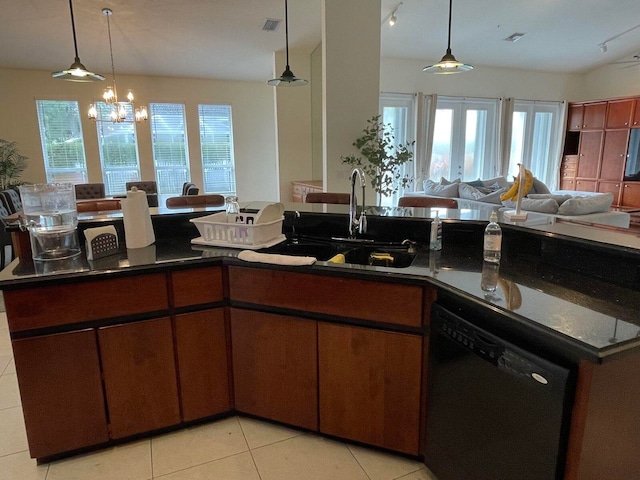 kitchen with black dishwasher, an inviting chandelier, a healthy amount of sunlight, and hanging light fixtures