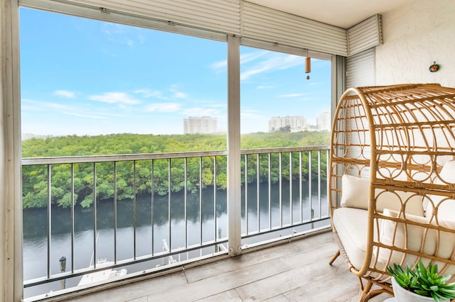 balcony featuring a water view