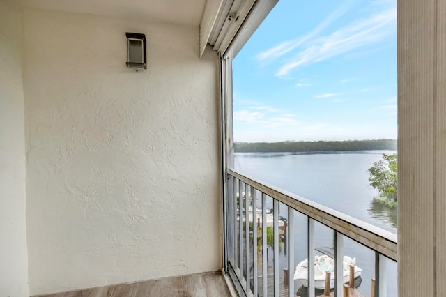 balcony featuring a water view