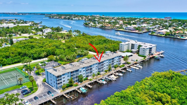 birds eye view of property with a water view