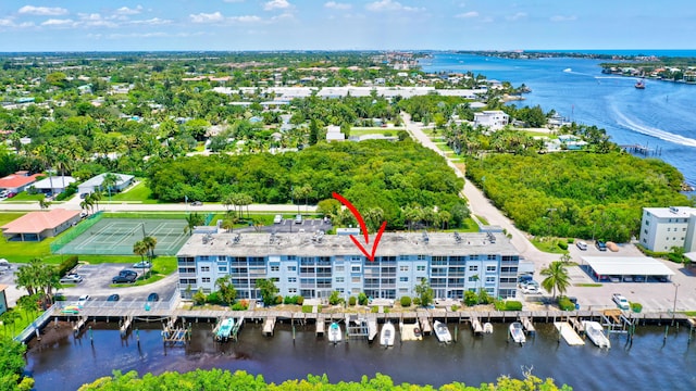 birds eye view of property with a water view