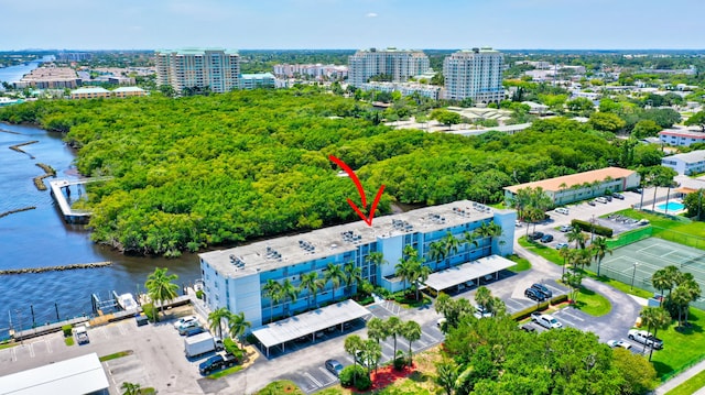 birds eye view of property with a water view