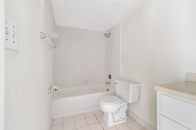 full bathroom featuring vanity, toilet, tiled shower / bath combo, and tile patterned floors