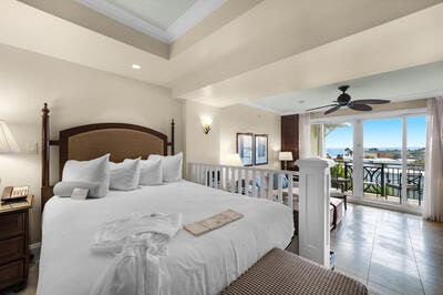 bedroom with ceiling fan, tile patterned floors, and access to exterior