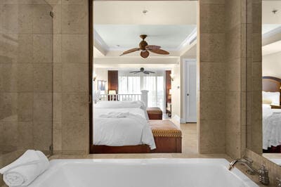 bedroom with crown molding and ceiling fan