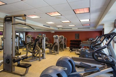 exercise room with a drop ceiling