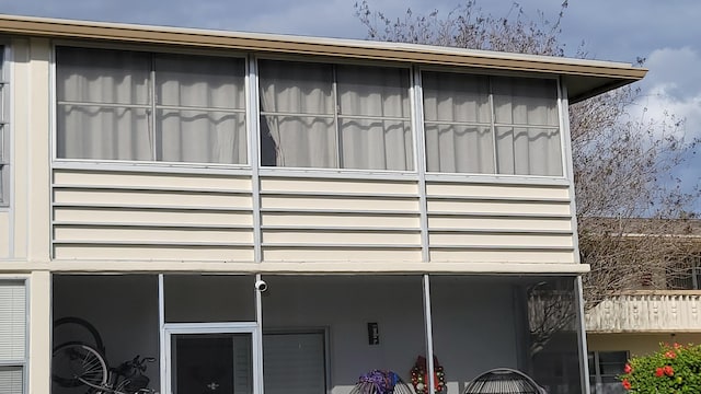 22 Northampton A, West Palm Beach, FL 33417 - view of side of home featuring a sunroom