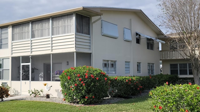 view of property exterior featuring a yard