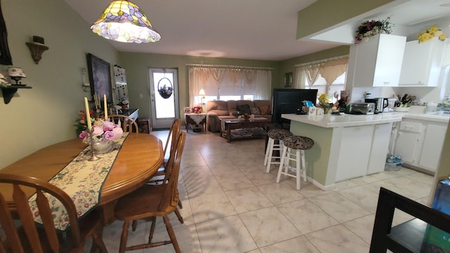 22 Northampton A, West Palm Beach, FL 33417 - dining area featuring light tile patterned floors