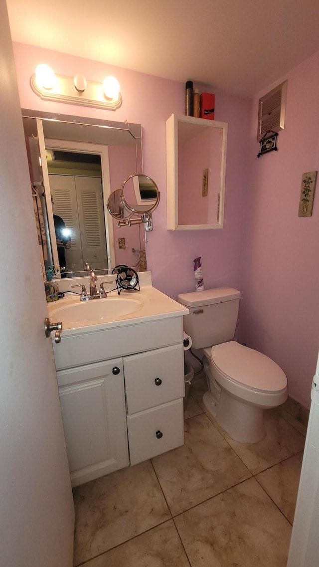 22 Northampton A, West Palm Beach, FL 33417 - bathroom featuring toilet, tile patterned flooring, and vanity